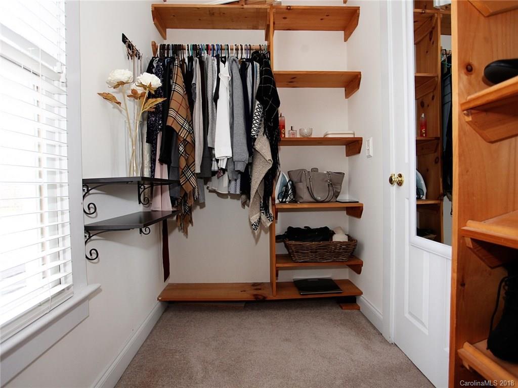 9399 Founders Street, Unit 164 Fort Mill, SC 29708 - Photo 22 of 36 a view of walk in closet with clothes and shoes