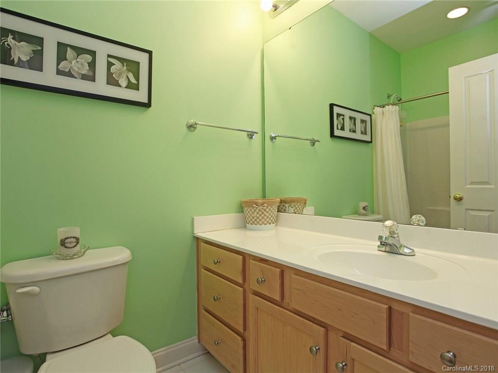 9399 Founders Street, Unit 164 Fort Mill, SC 29708 - Photo 27 of 36 a bathroom with a toilet sink and mirror