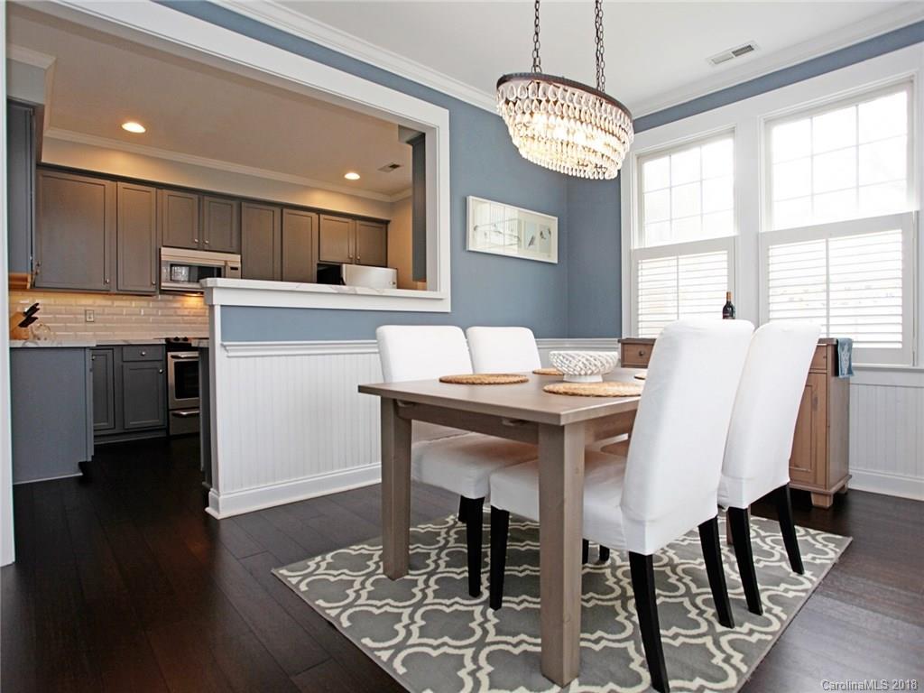 9399 Founders Street, Unit 164 Fort Mill, SC 29708 - Photo 6 of 36 a view of a dining room with furniture window and wooden floor