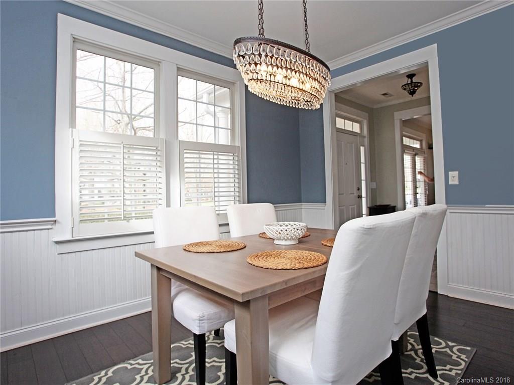 9399 Founders Street, Unit 164 Fort Mill, SC 29708 - Photo 7 of 36 a view of a dining room with furniture window and wooden floor