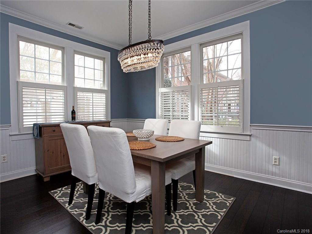 9399 Founders Street, Unit 164 Fort Mill, SC 29708 - Photo 8 of 36 a view of a dining room with furniture window and wooden floor