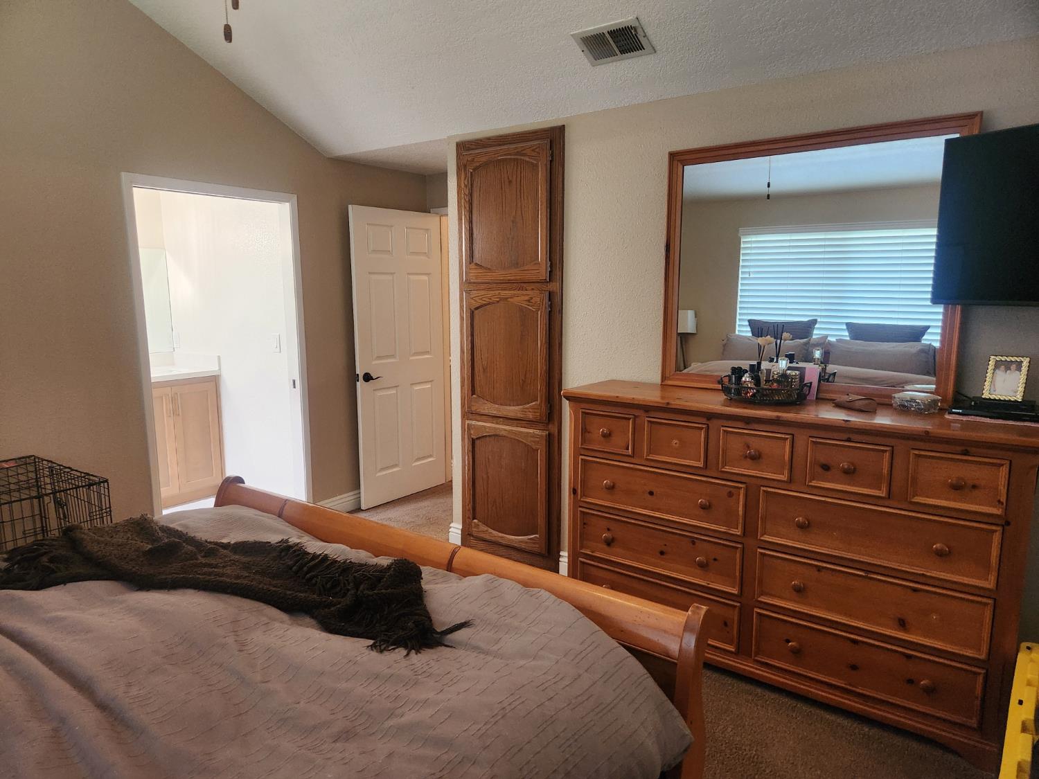 777 Jordanolo Drive Ripon, CA 95366 - Photo 31 of 61 a bedroom with a bed and a dresser