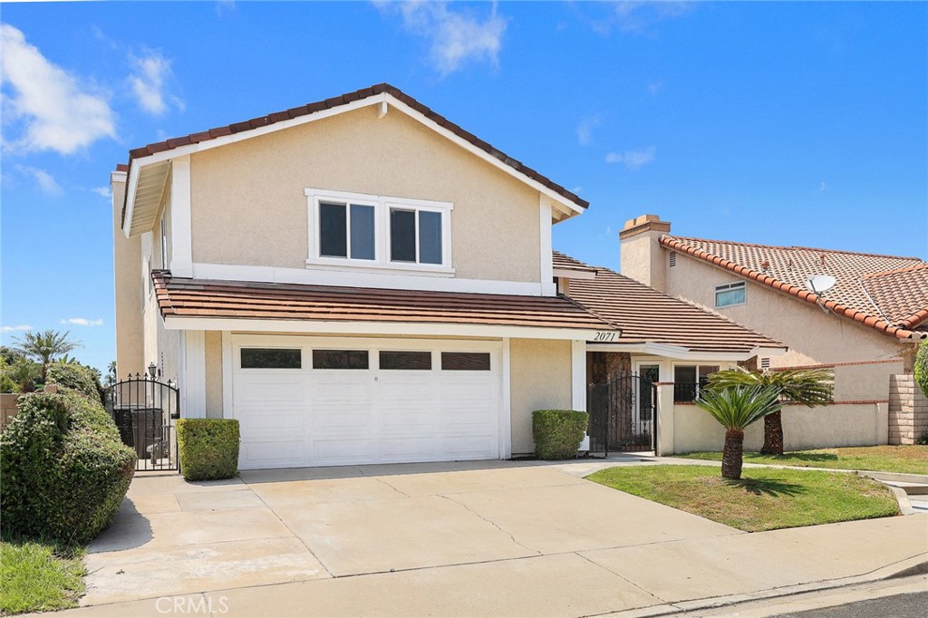 2071 Peaceful Hills Road Diamond Bar, CA 91765 - Photo 1 of 1 a front view of a house with garden