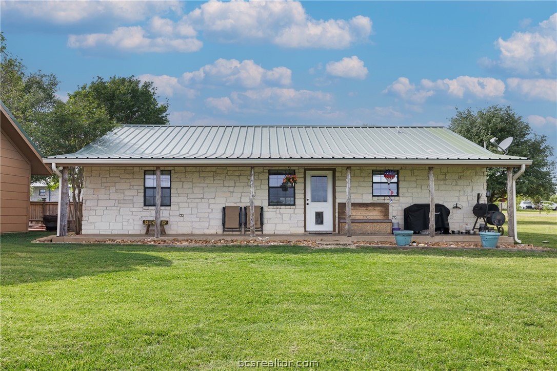 3540 Fisher Ranch Road Bryan, TX 77808 - Photo 23 of 36 a front view of a house with a garden and sitting area
