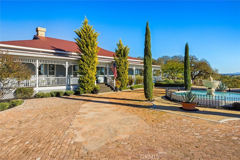6970 Benton Road Paso Robles, CA 93446 - Photo 3 of 74 a front view of a house with a garden