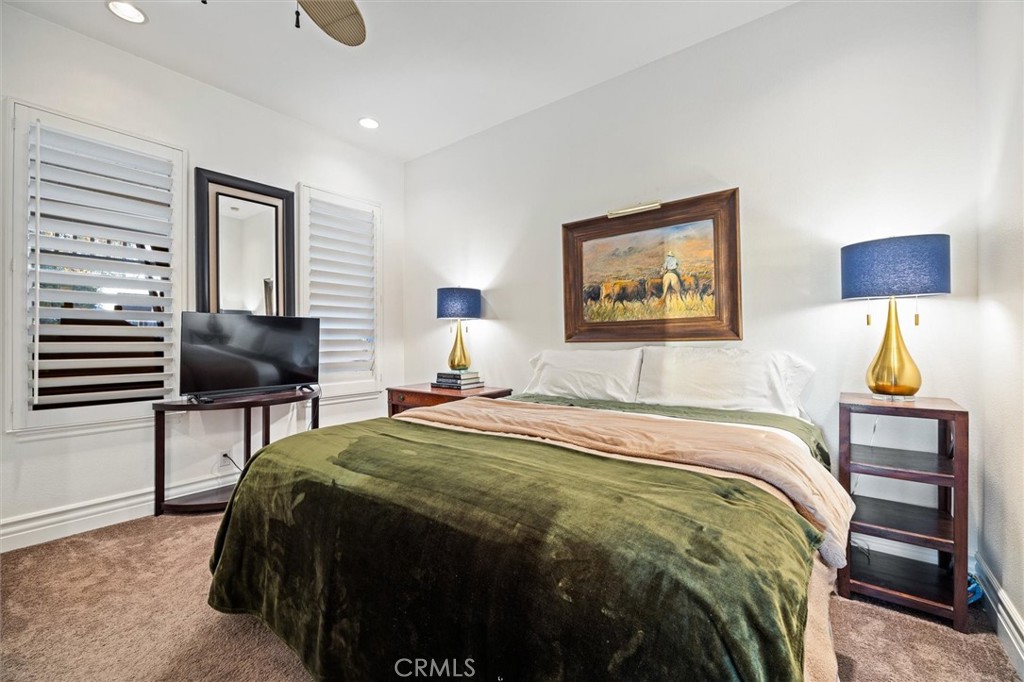6970 Benton Road Paso Robles, CA 93446 - Photo 42 of 74 a bedroom with a bed and a lamp on table