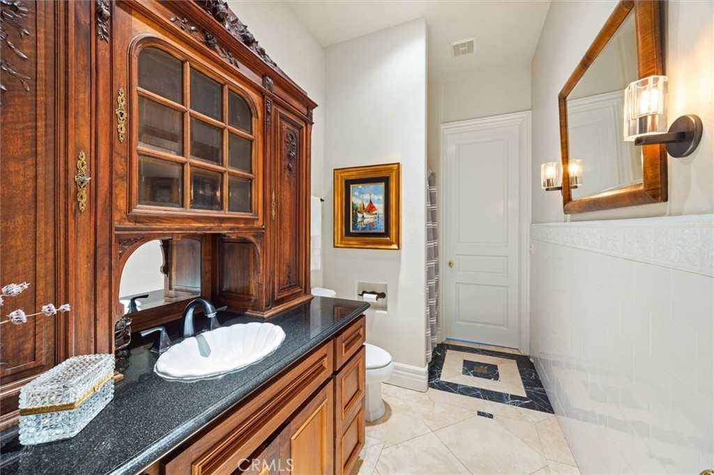 6970 Benton Road Paso Robles, CA 93446 - Photo 49 of 74 a bathroom with a sink and a mirror