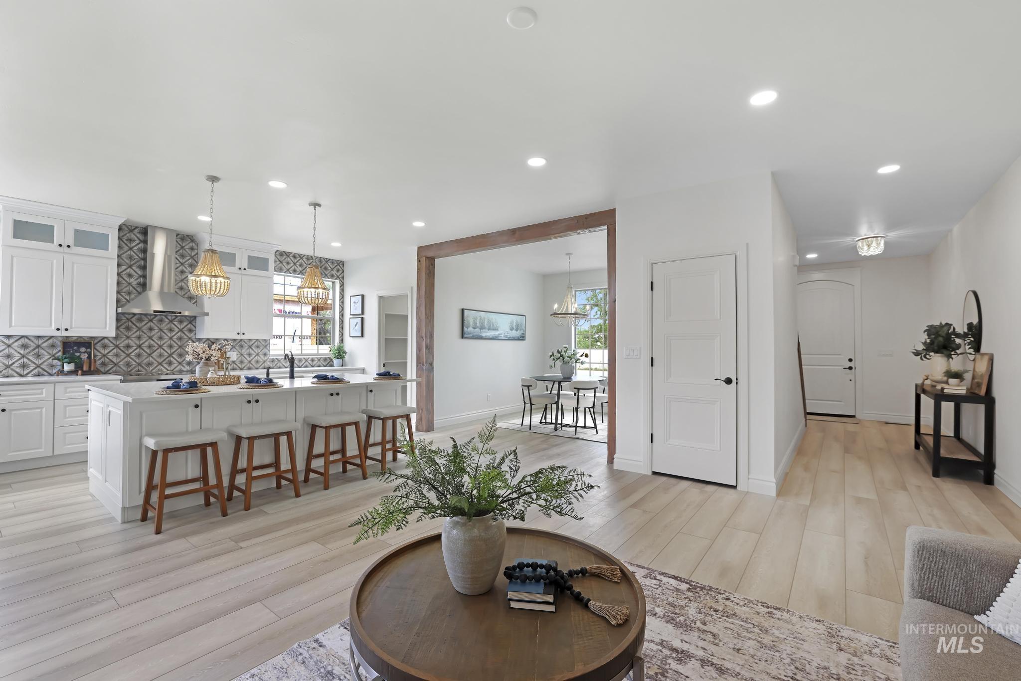 866 Quartz Road Kimberly, ID 83341 - Photo 12 of 48 Open-concept living area featuring light wood-finish flooring, recessed lighting, and a kitchen with white cabinetry