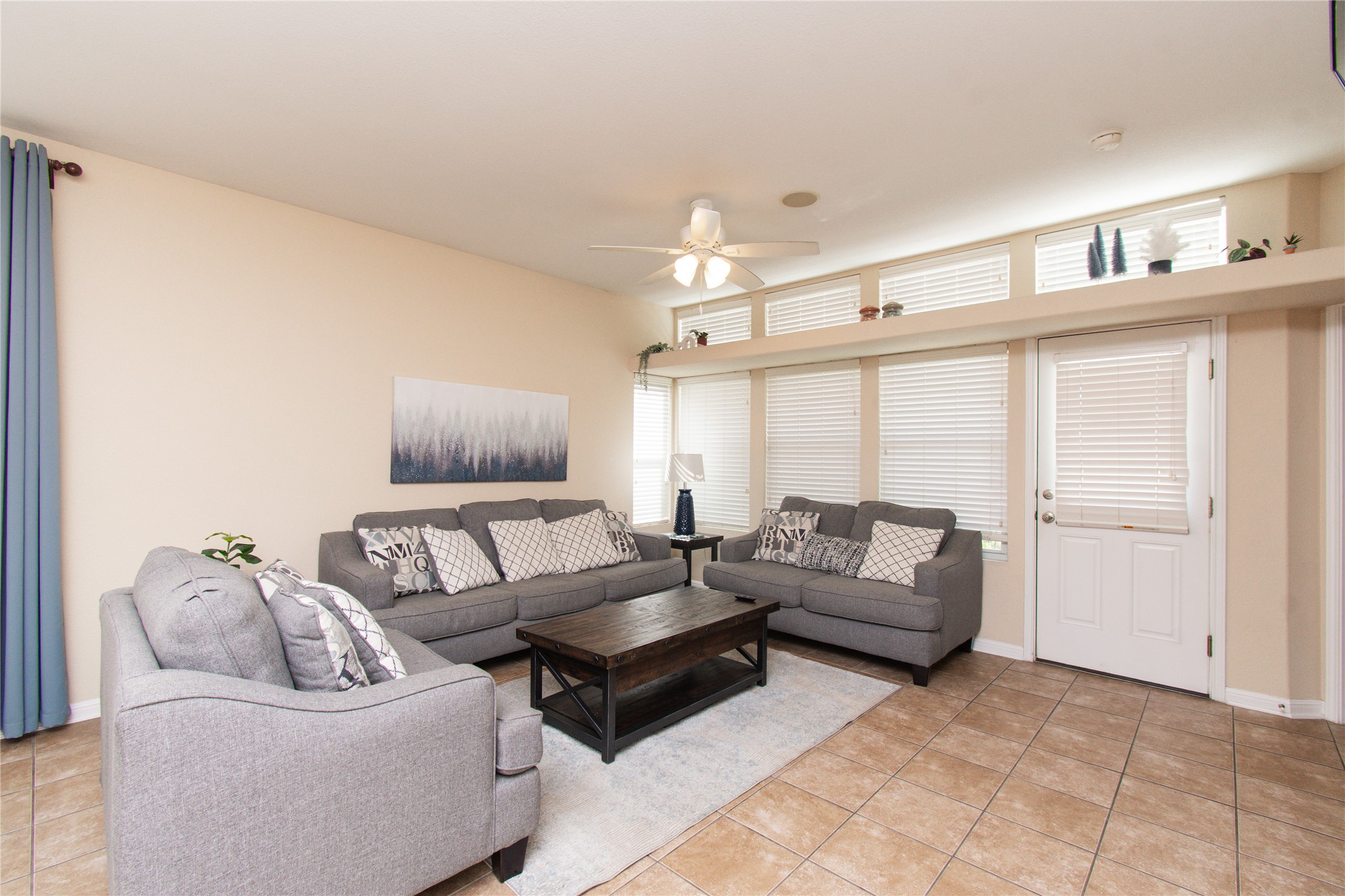 421 Shadow Point San Marcos, TX 78666 - Photo 5 of 24 Living room featuring ceiling fan and light tile patterned flooring
