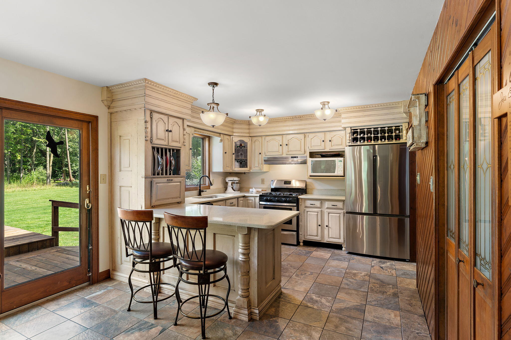 249 West 700 North Valparaiso, IN 46385 - Photo 14 of 46 a kitchen with stainless steel appliances granite countertop a refrigerator and a stove top oven