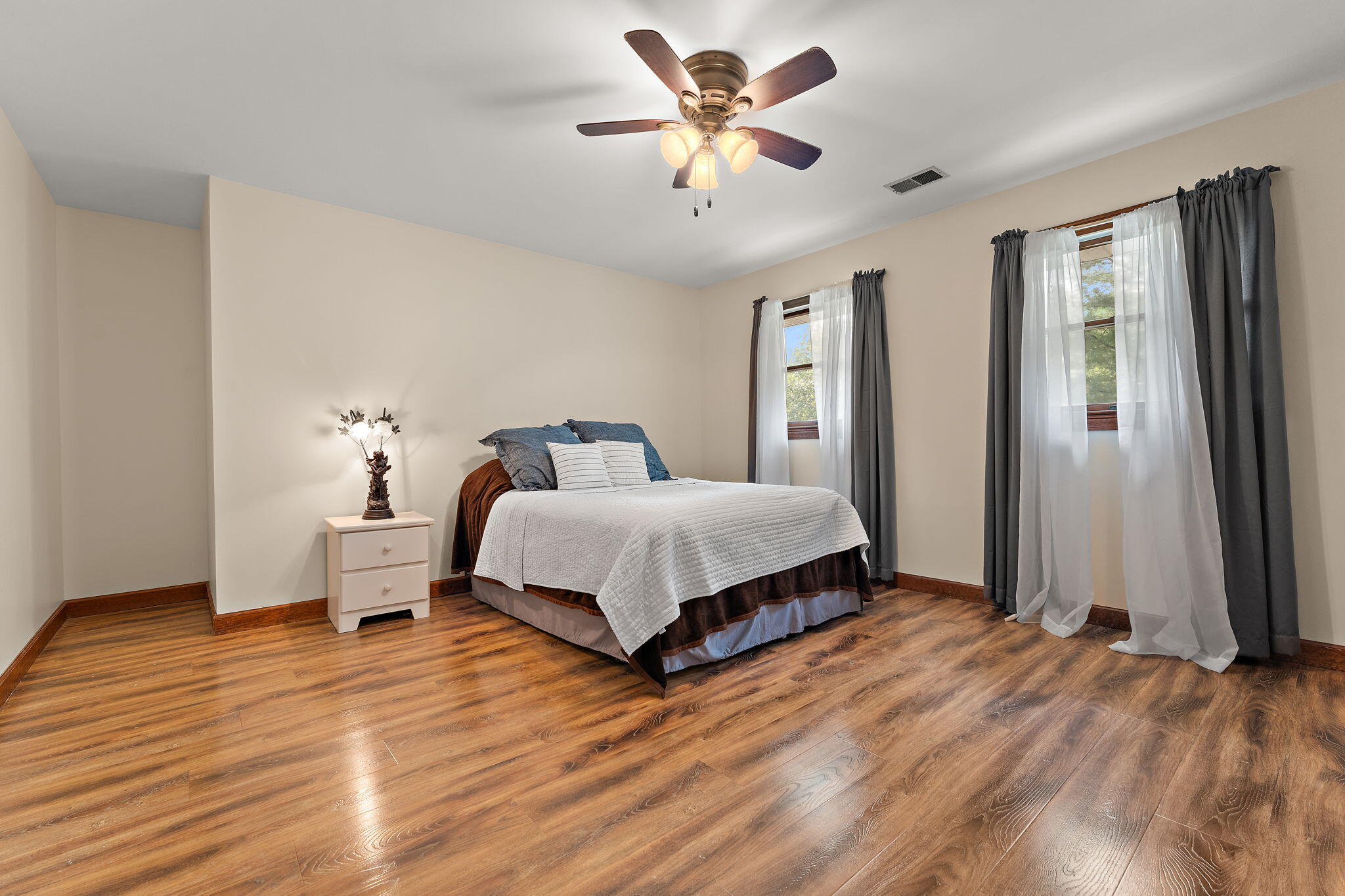 249 West 700 North Valparaiso, IN 46385 - Photo 20 of 46 a bedroom with a bed chandelier and a window