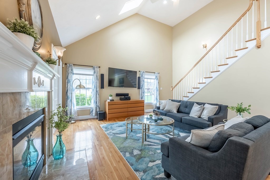 2 Hay Bale Road Andover, MA 01810 - Photo 13 of 42 a living room with furniture and a flat screen tv