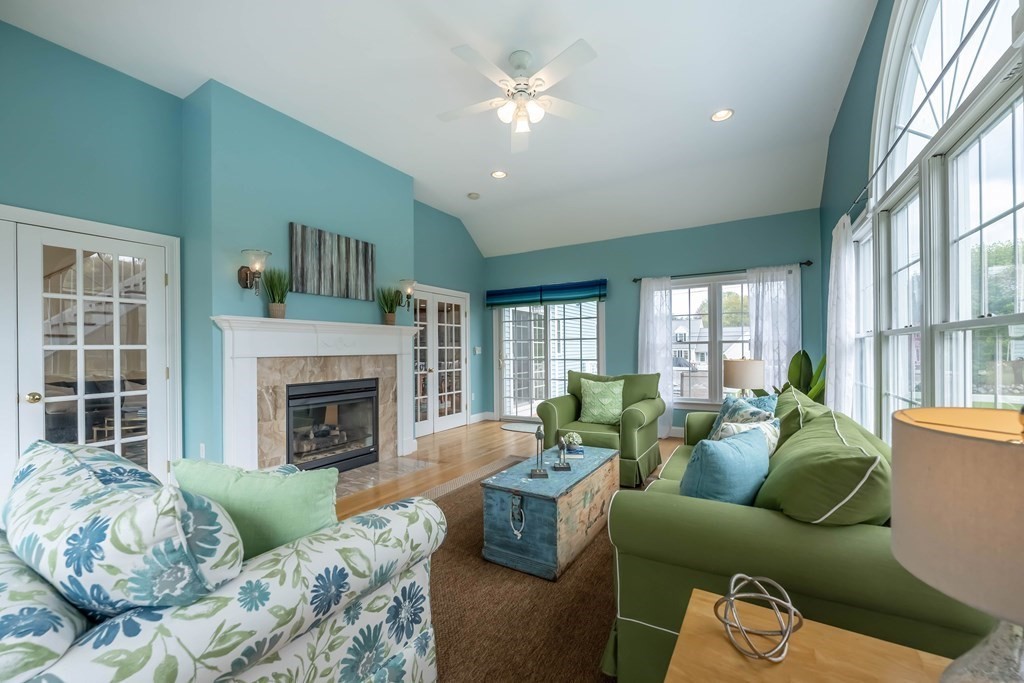 2 Hay Bale Road Andover, MA 01810 - Photo 14 of 42 a living room with furniture and a fireplace
