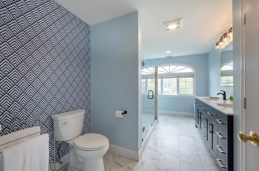 2 Hay Bale Road Andover, MA 01810 - Photo 22 of 42 a bathroom with a toilet sink and mirror