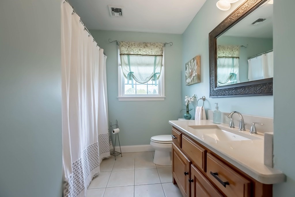 2 Hay Bale Road Andover, MA 01810 - Photo 27 of 42 a bathroom with a sink a toilet and a mirror