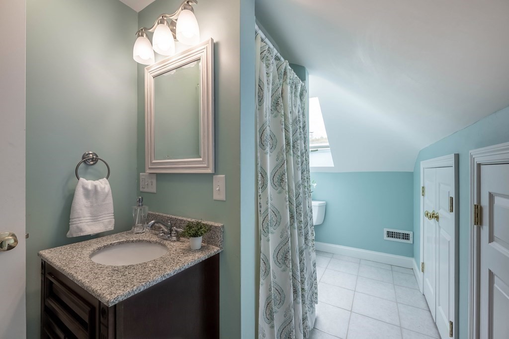 2 Hay Bale Road Andover, MA 01810 - Photo 30 of 42 a bathroom with a granite countertop sink and a mirror