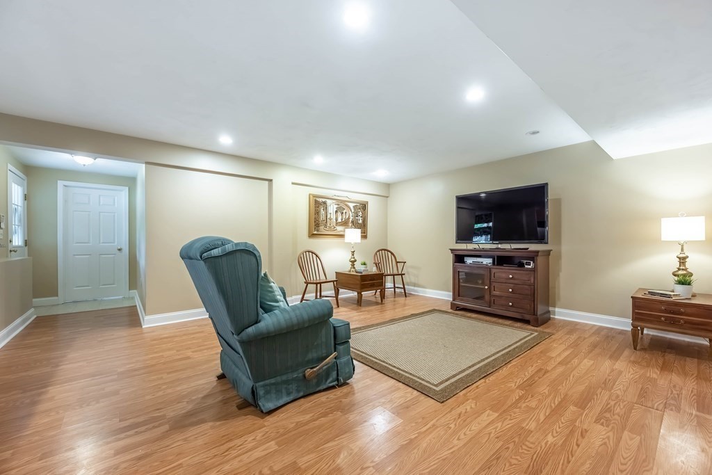 2 Hay Bale Road Andover, MA 01810 - Photo 33 of 42 a living room with furniture and a flat screen tv