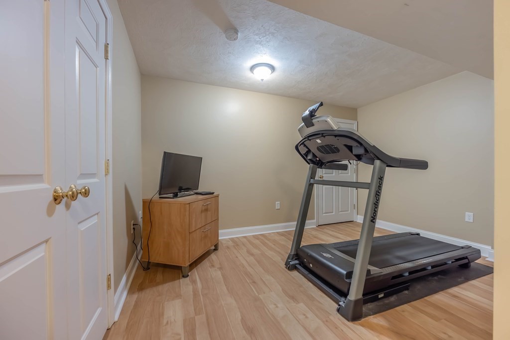 2 Hay Bale Road Andover, MA 01810 - Photo 38 of 42 a room with gym equipment and wooden floor