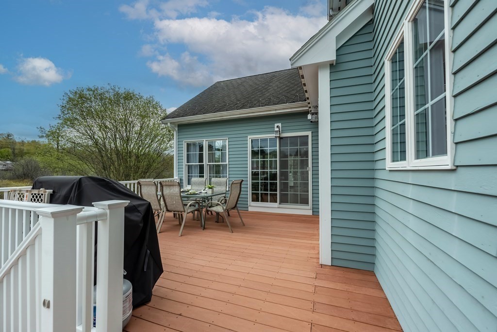 2 Hay Bale Road Andover, MA 01810 - Photo 41 of 42 a view of a patio with table and chairs and wooden floor