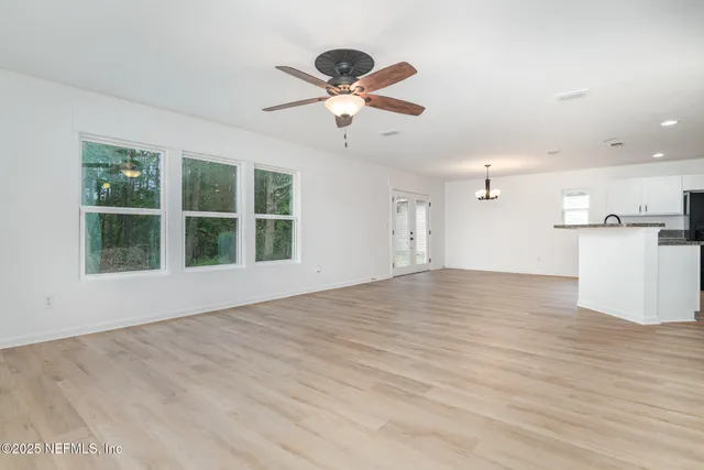 a view of a kitchen with a sink and a window