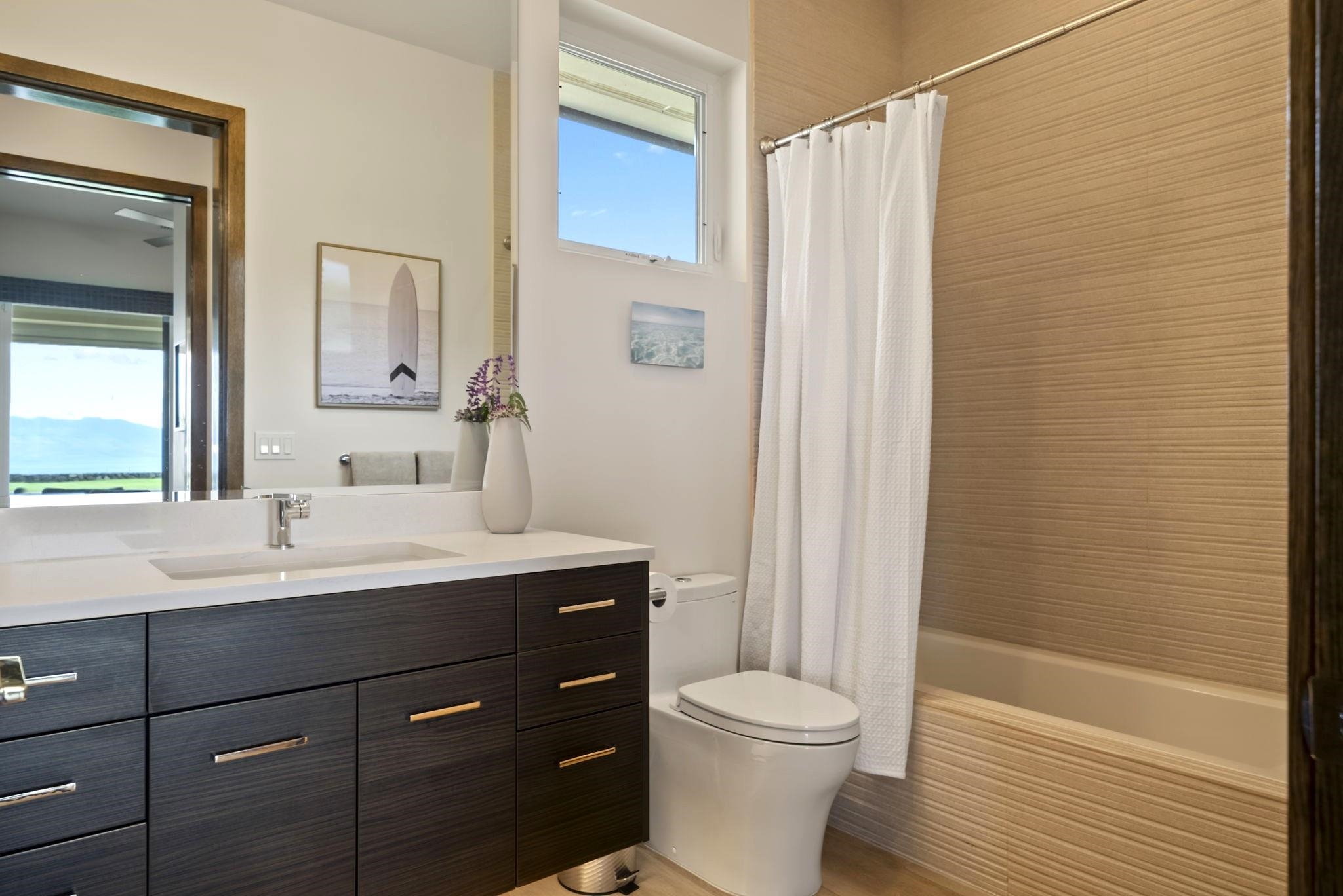 123 Punakea Loop, Unit A Lahaina, HI 96761 - Photo 18 of 50 a bathroom with a sink a toilet and shower