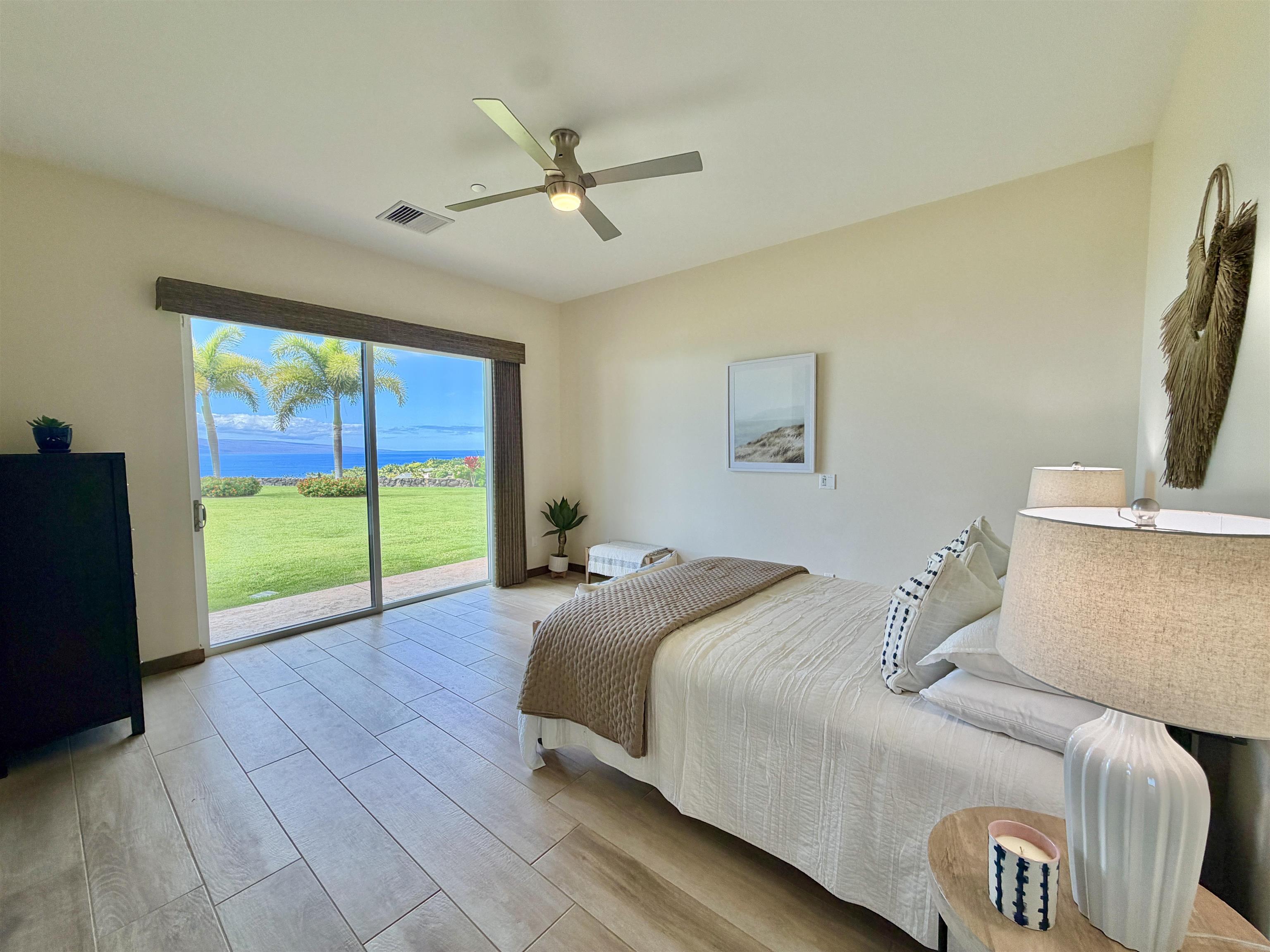 123 Punakea Loop, Unit A Lahaina, HI 96761 - Photo 32 of 50 a bed room with a bed and a television