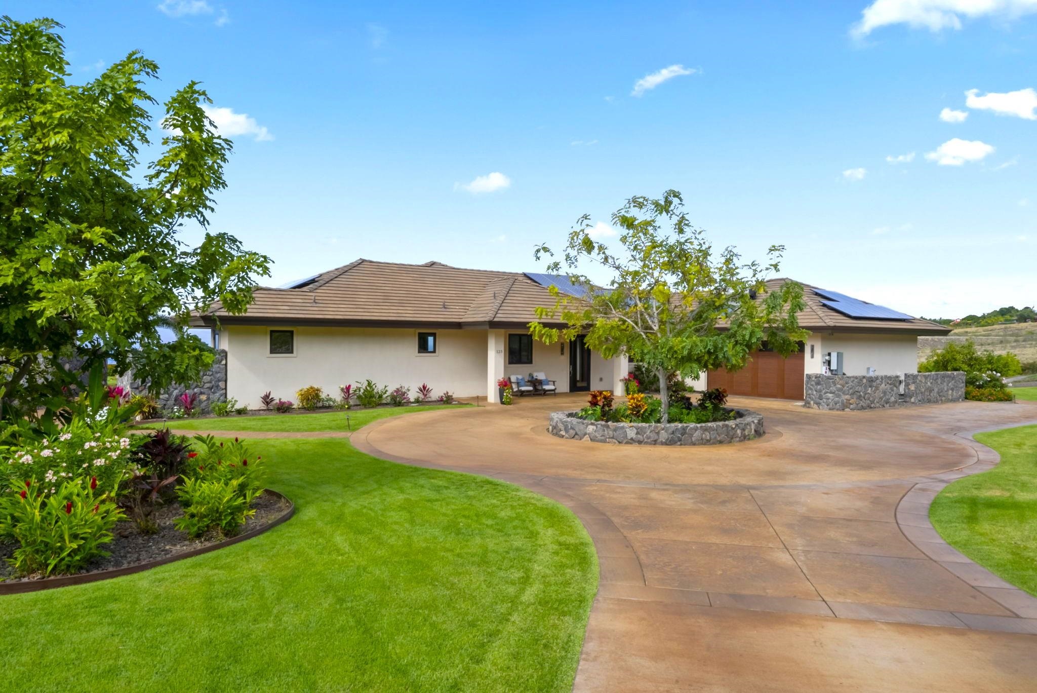 123 Punakea Loop, Unit A Lahaina, HI 96761 - Photo 37 of 50 a view of a house with a yard and a garden