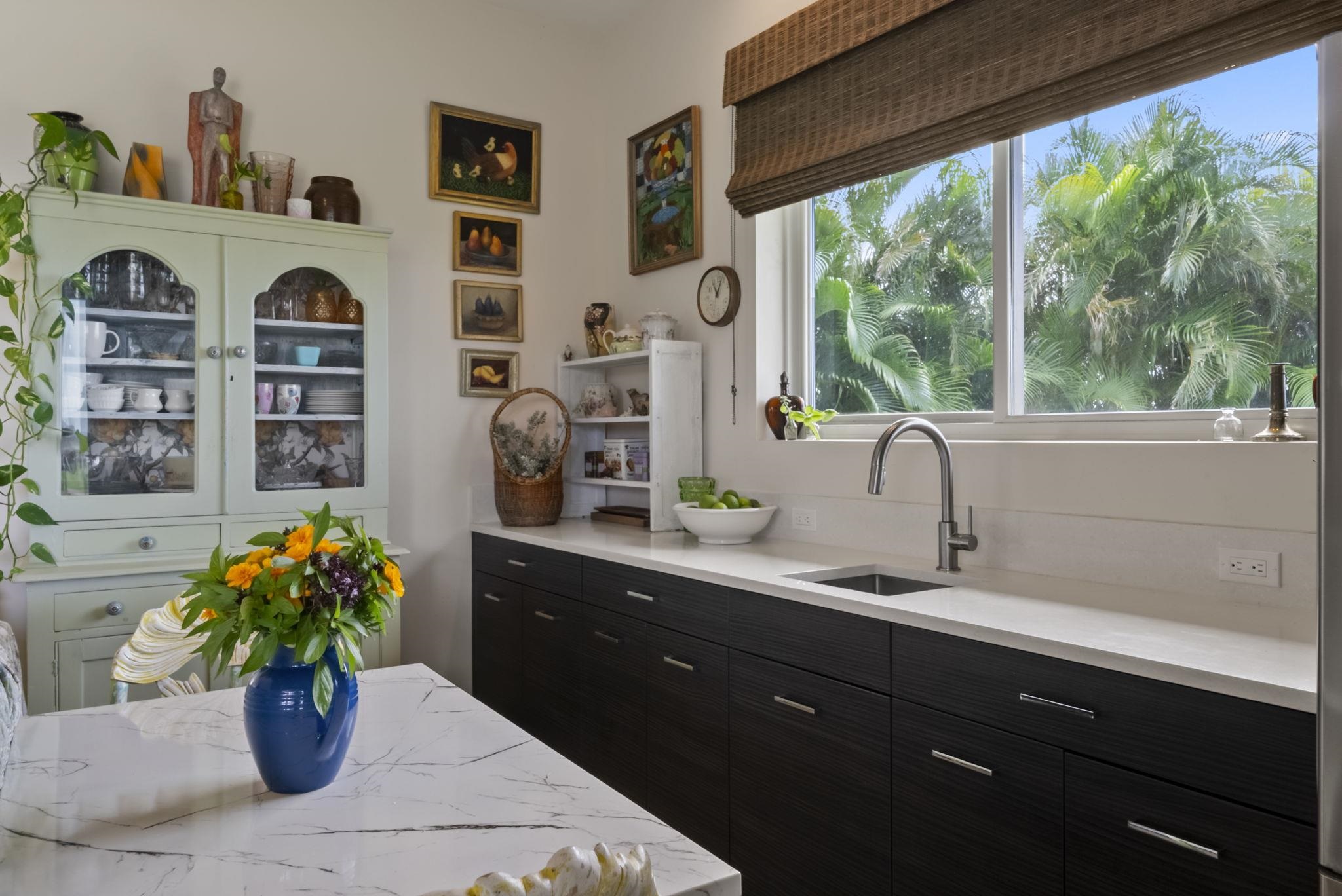 123 Punakea Loop, Unit A Lahaina, HI 96761 - Photo 40 of 50 a dining room with furniture and flower vase