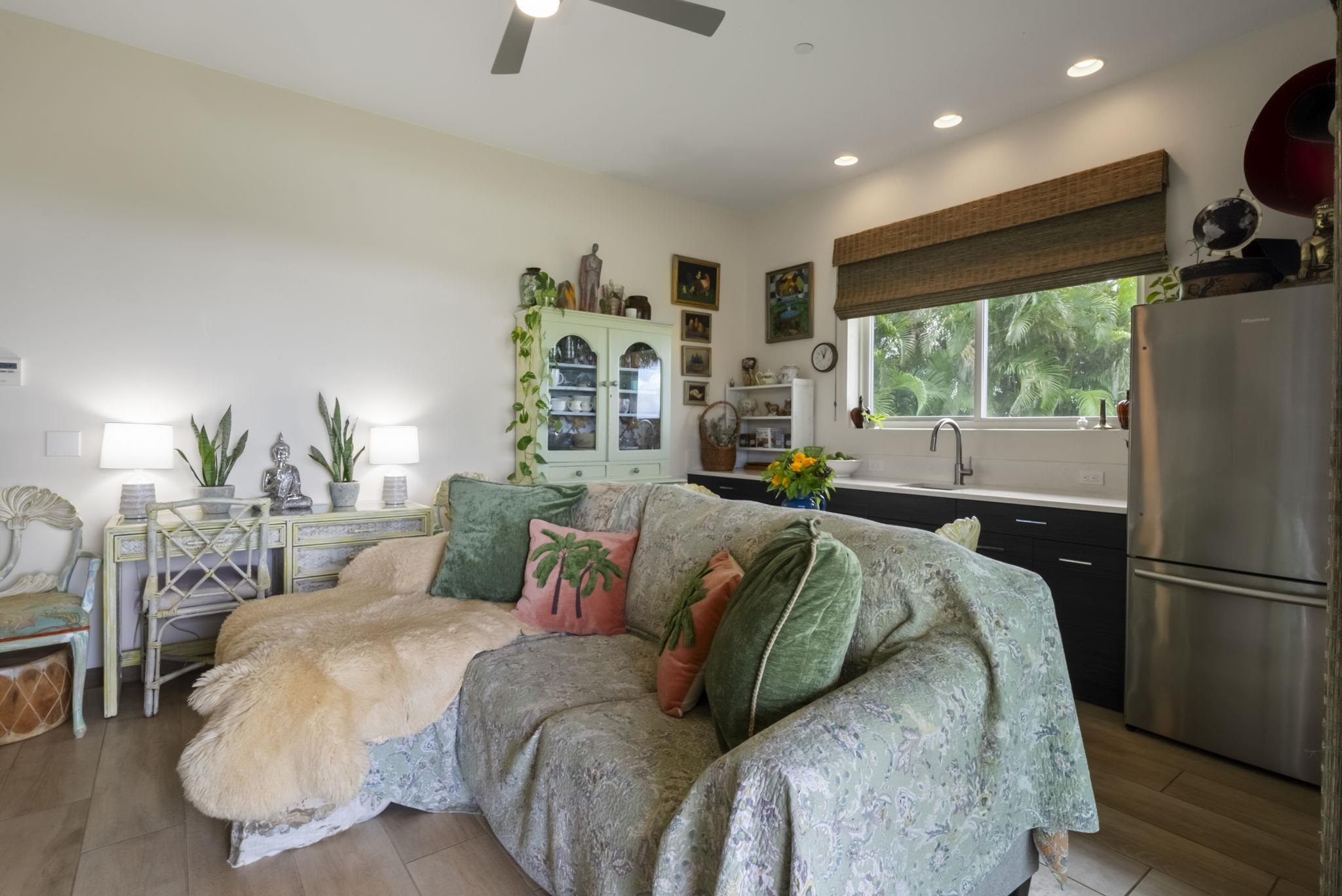 123 Punakea Loop, Unit A Lahaina, HI 96761 - Photo 41 of 50 a bed sitting in a bedroom next to a window