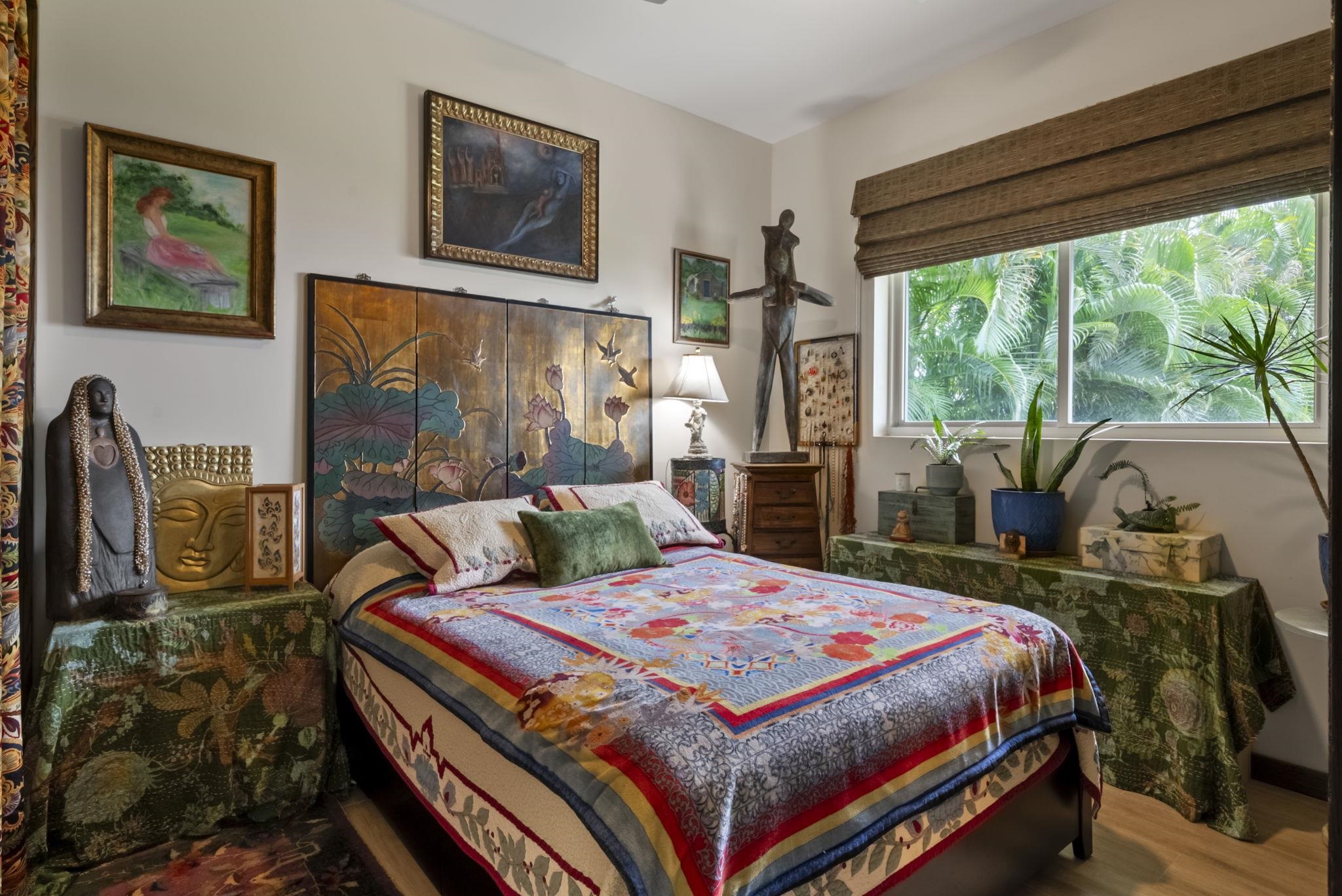 123 Punakea Loop, Unit A Lahaina, HI 96761 - Photo 42 of 50 a bedroom with a bed a table and chair