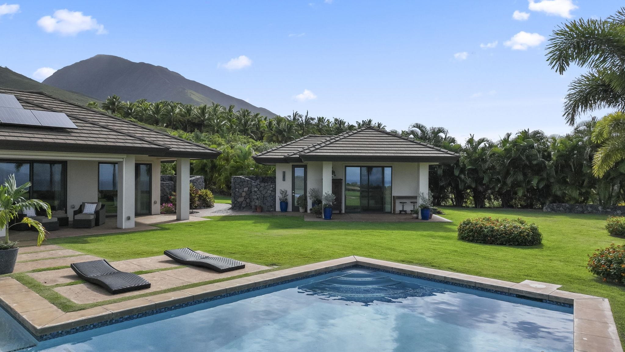 123 Punakea Loop, Unit A Lahaina, HI 96761 - Photo 47 of 50 a view of a house with a yard and patio