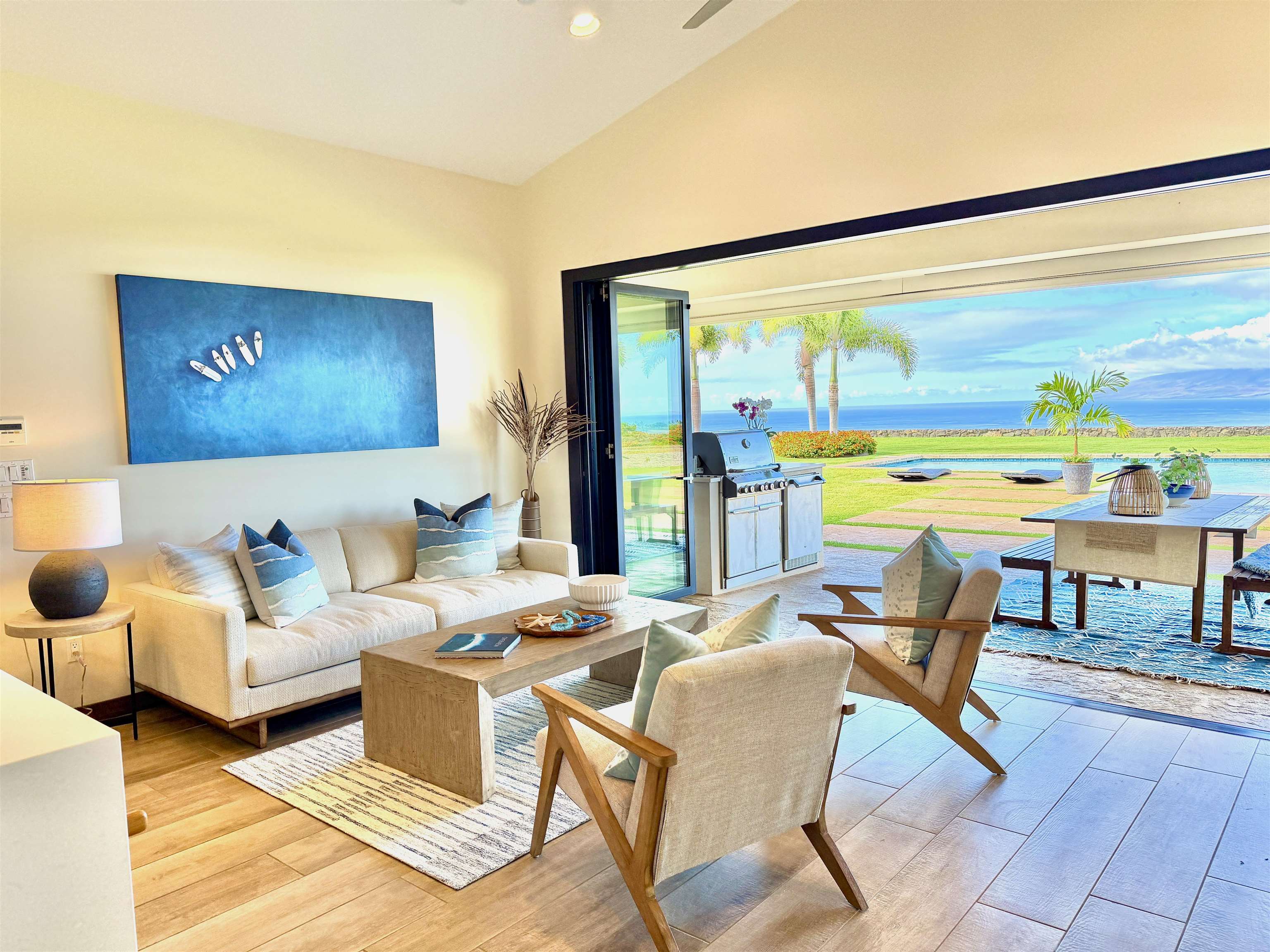 123 Punakea Loop, Unit A Lahaina, HI 96761 - Photo 7 of 50 a living room with furniture and a floor to ceiling window