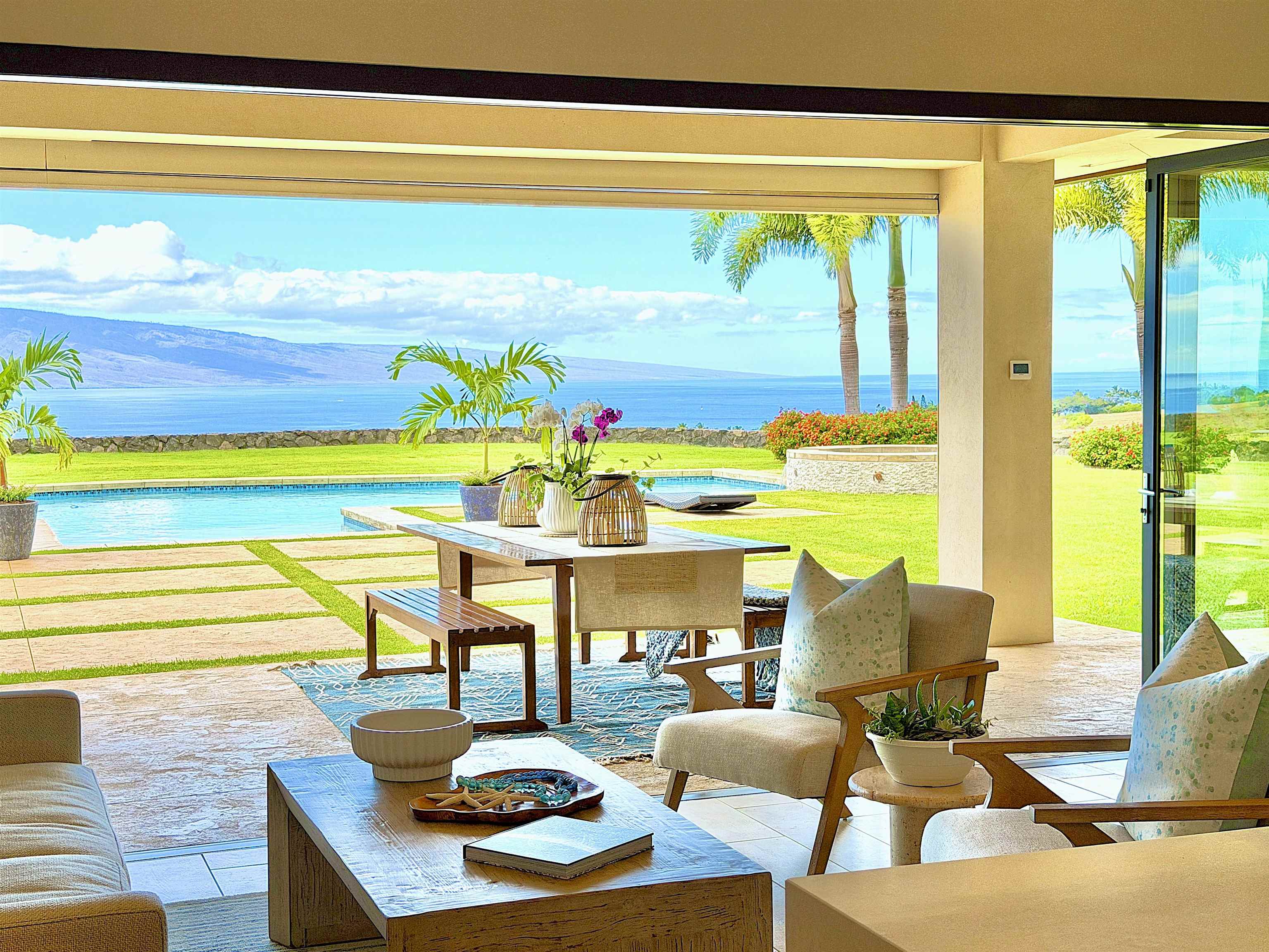 123 Punakea Loop, Unit A Lahaina, HI 96761 - Photo 8 of 50 a living room with furniture and a floor to ceiling window