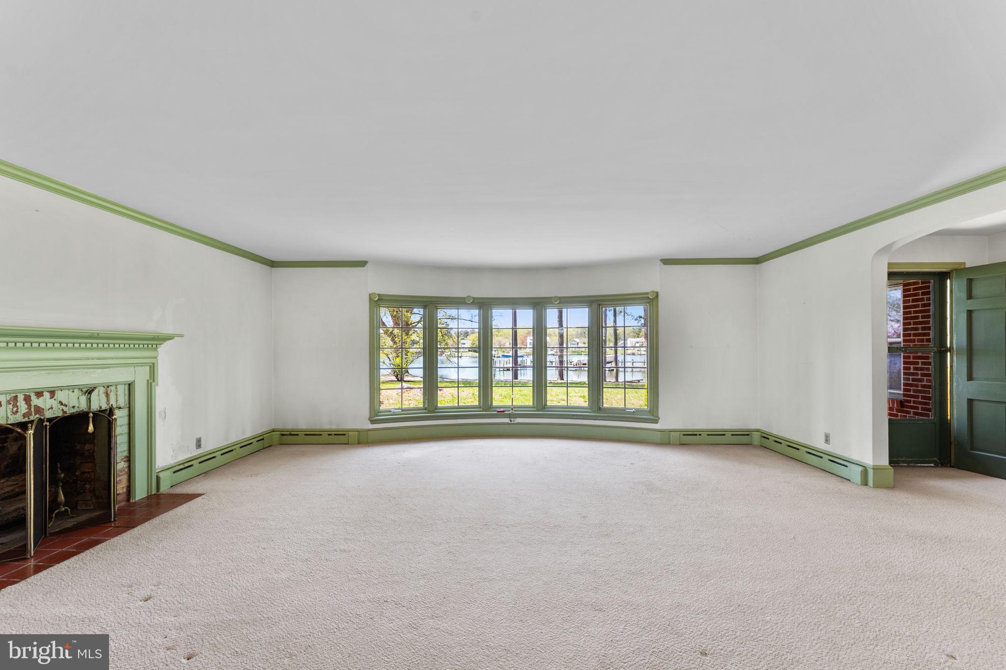137 Pine Drive Reedville, VA 22539 - Photo 6 of 36 an empty room with windows