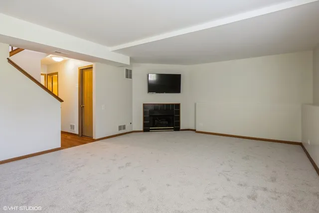 a view of hallway with furniture and a window