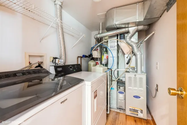 a balcony with wooden floor and fence
