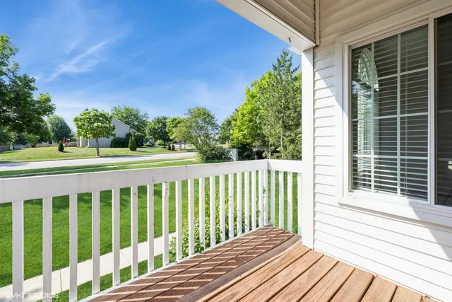 a view of a house with a yard and garage