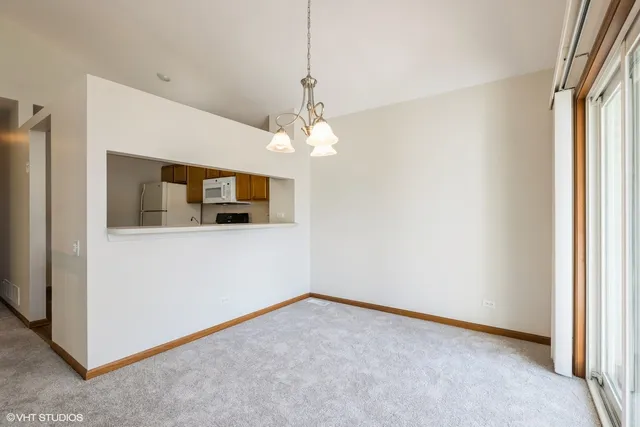 a kitchen with stainless steel appliances a sink stove and cabinets