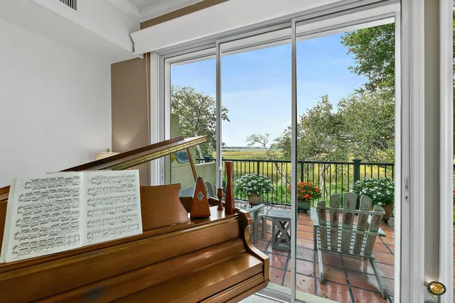 a dining room with furniture and a chandelier