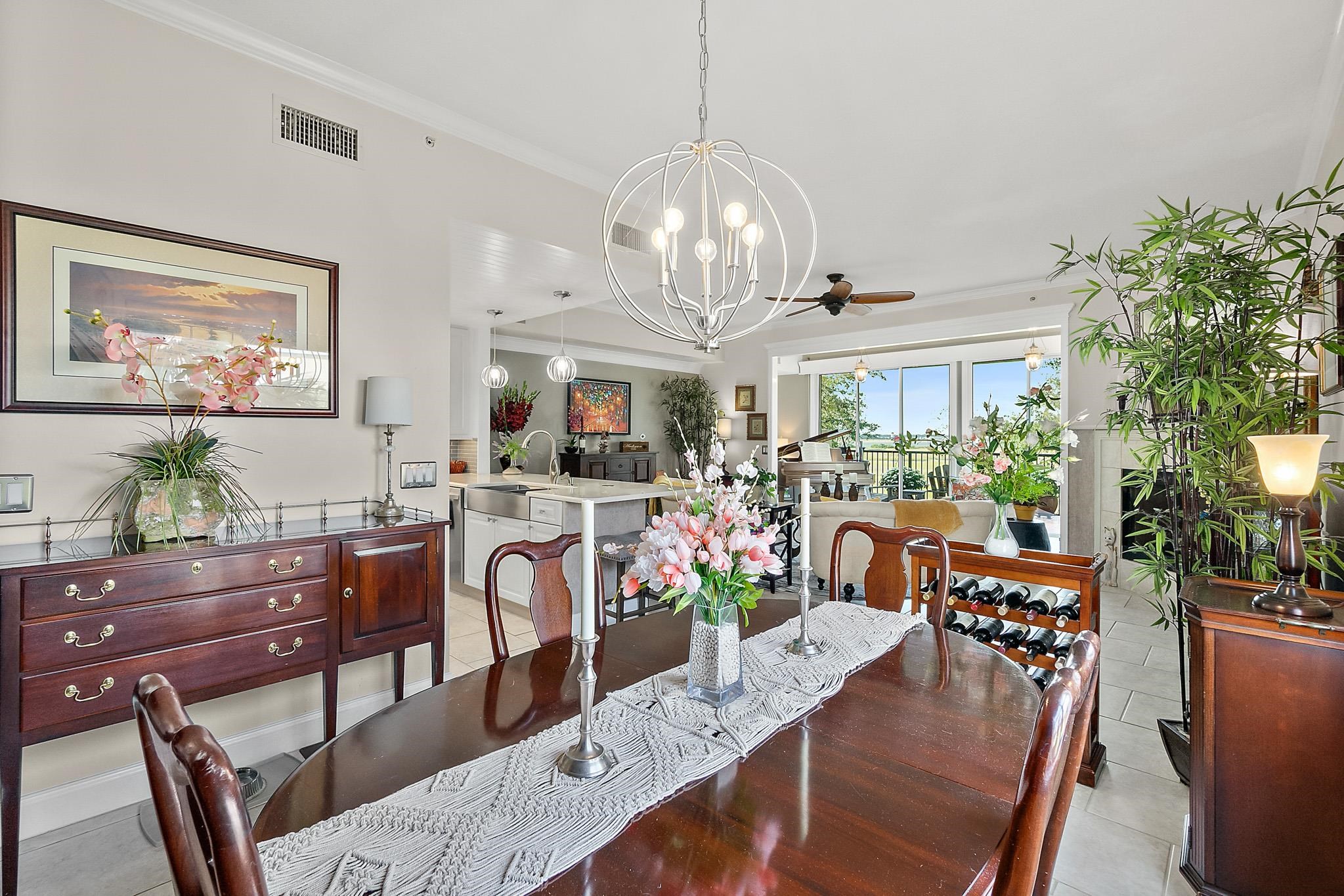 1602 Windjammer Lane St. Augustine, FL 32084 - Photo 30 of 85 a view of a dining room with furniture and a chandelier