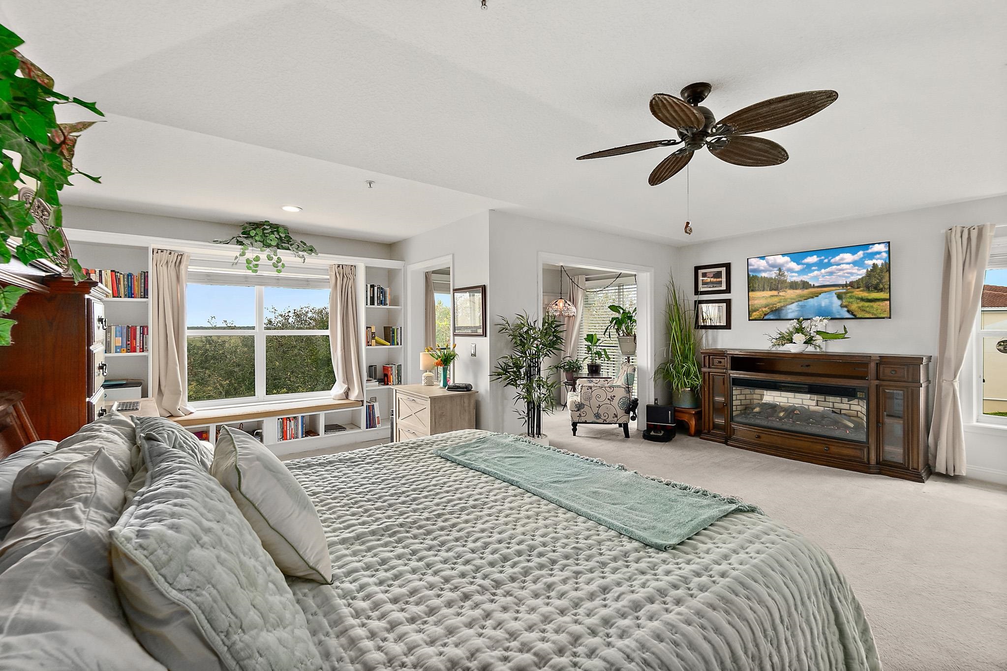 1602 Windjammer Lane St. Augustine, FL 32084 - Photo 42 of 85 a bedroom with a bed and a flat tv screen on dresser