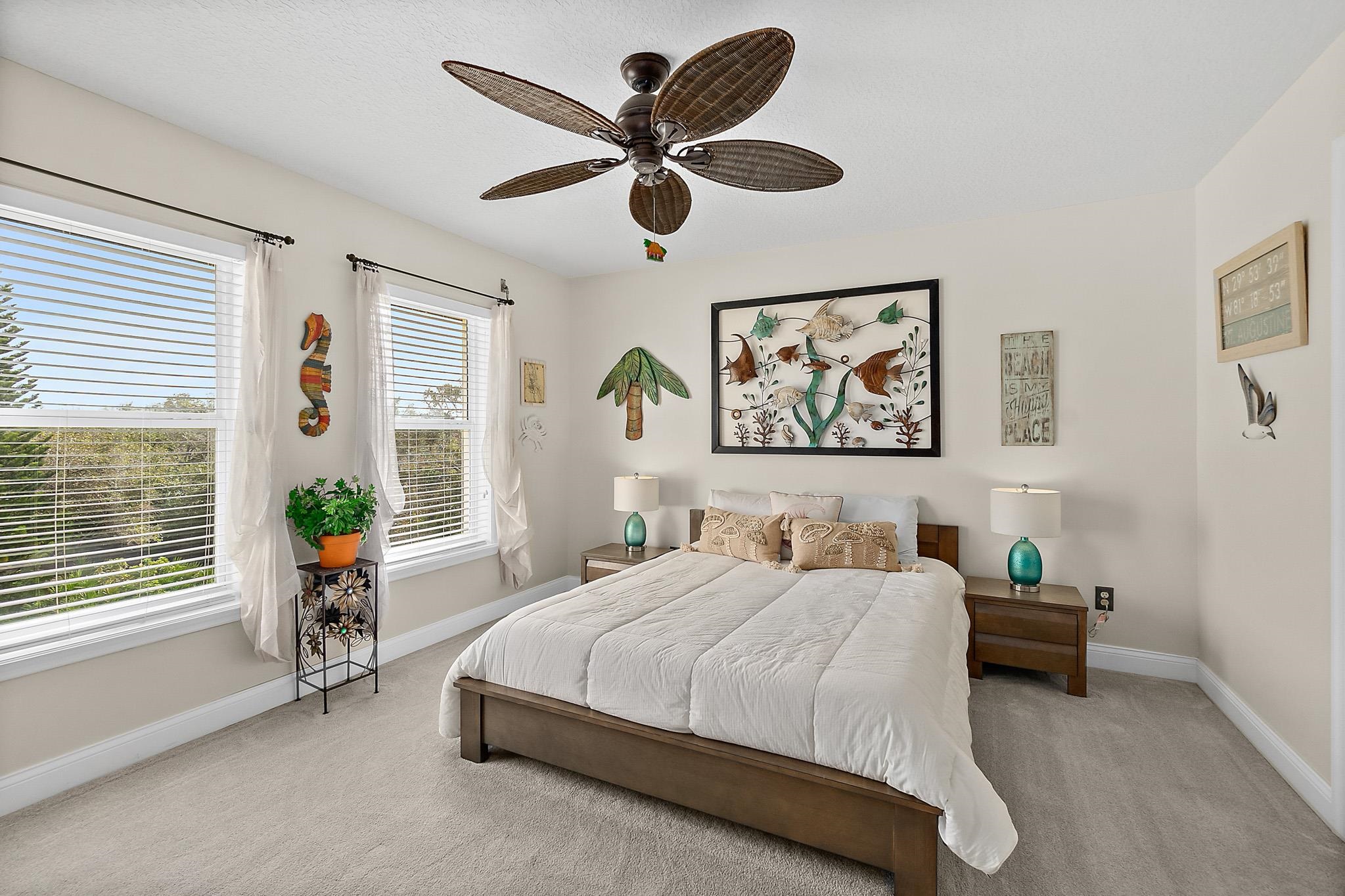 1602 Windjammer Lane St. Augustine, FL 32084 - Photo 51 of 85 a bedroom with a bed and a large window