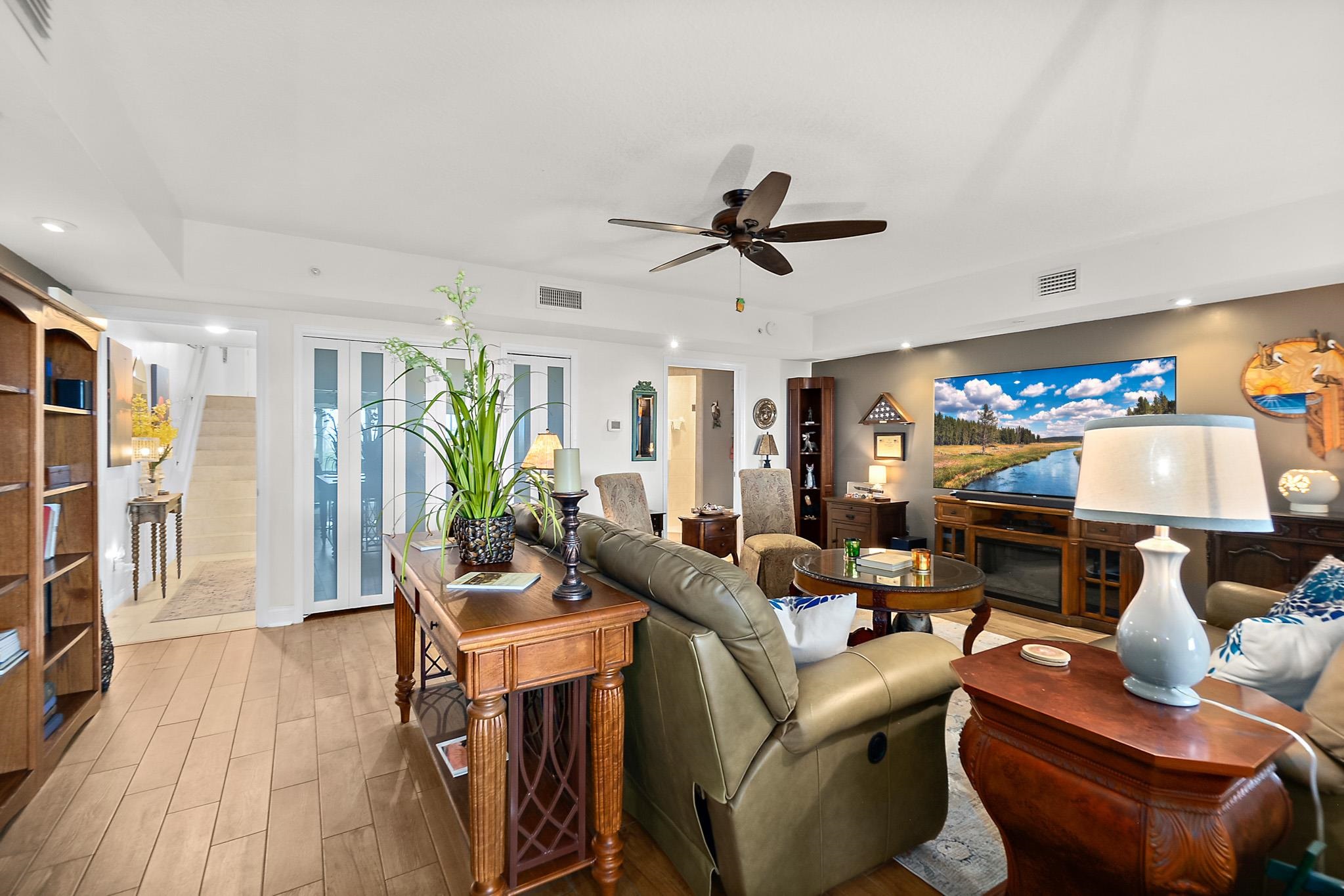 1602 Windjammer Lane St. Augustine, FL 32084 - Photo 61 of 85 a living room with furniture and a flat screen tv