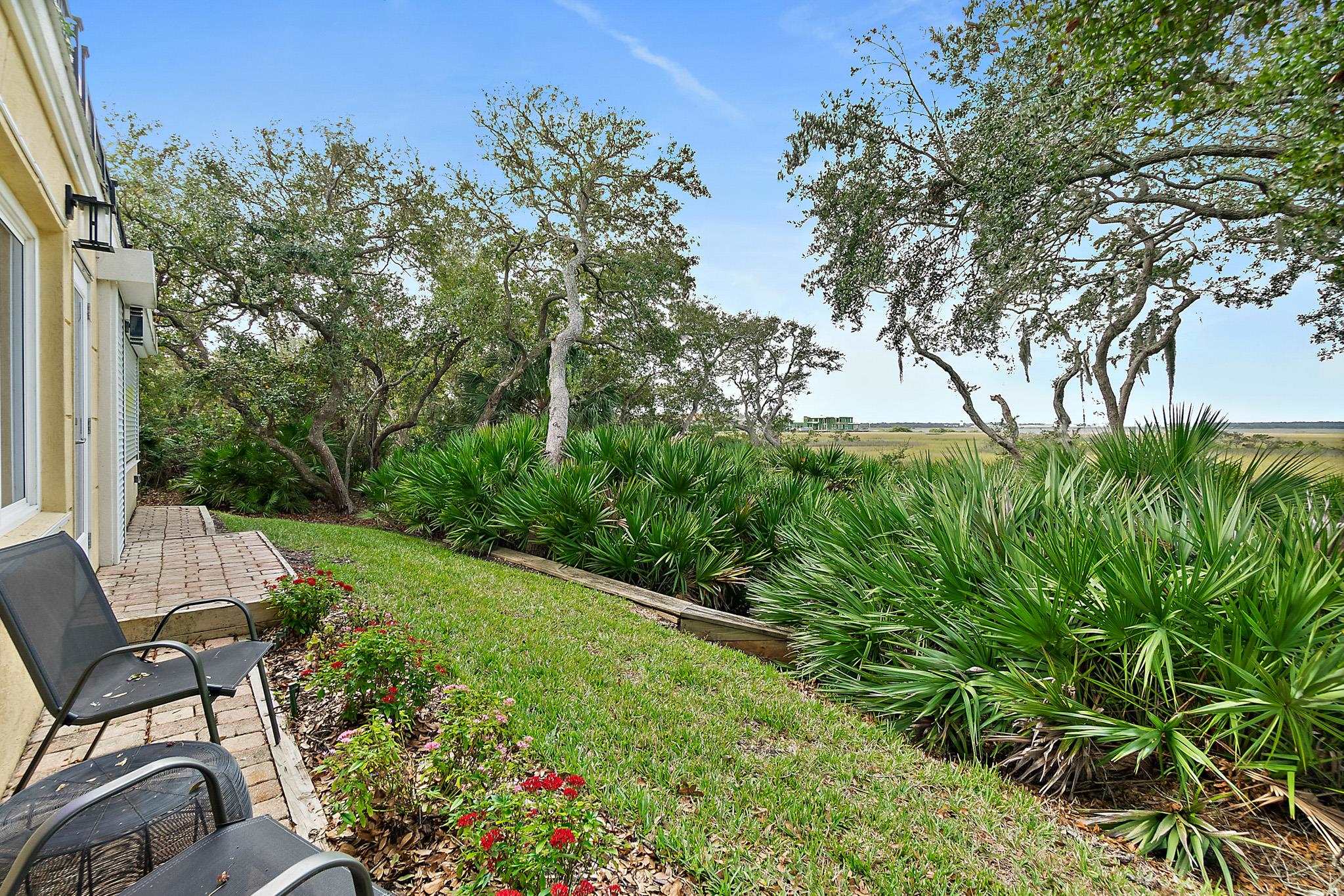 1602 Windjammer Lane St. Augustine, FL 32084 - Photo 69 of 85 a view of a chair and table in the garden
