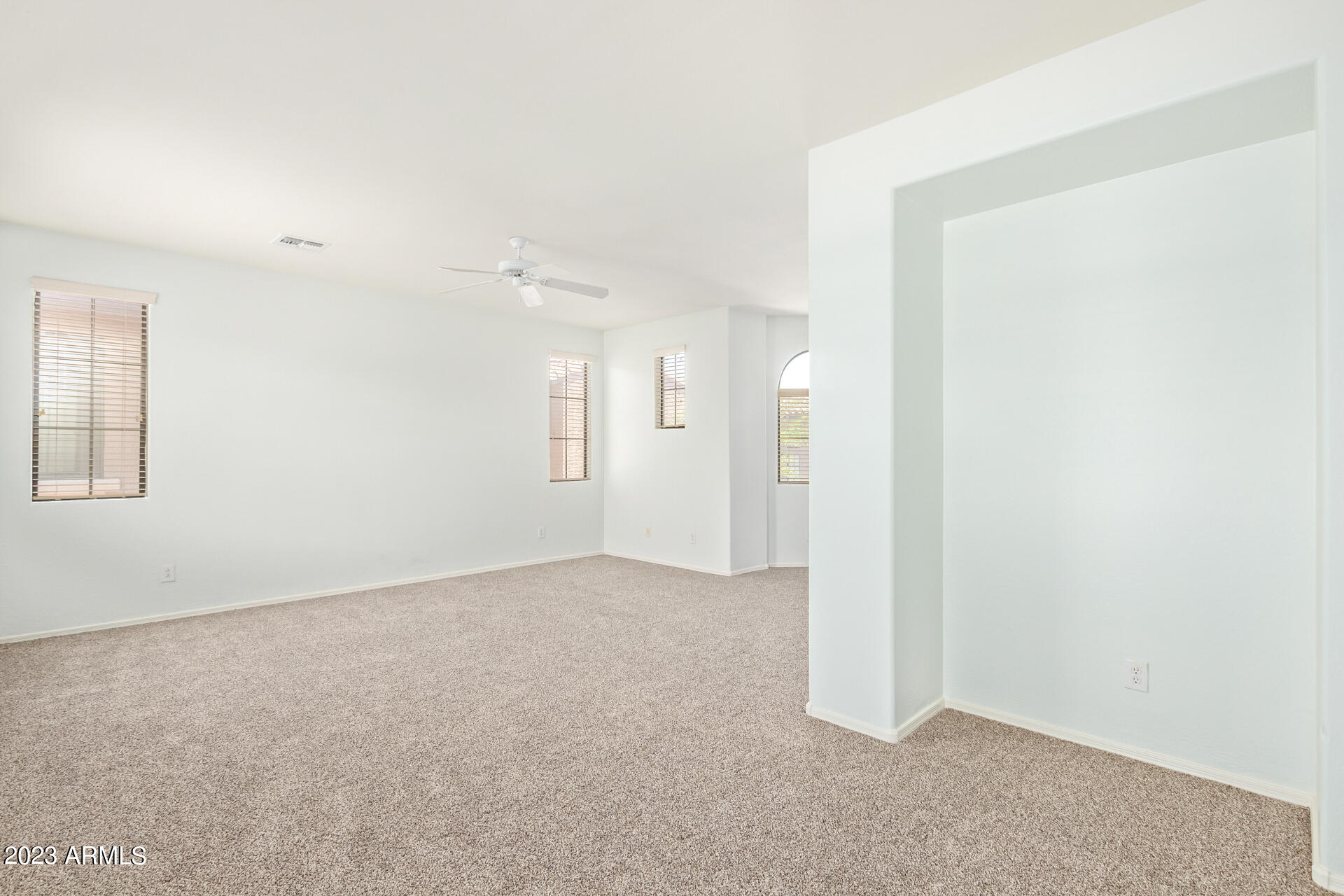 2390 West Sleepy Ranch Road Phoenix, AZ 85085 - Photo 13 of 27 an empty room with windows
