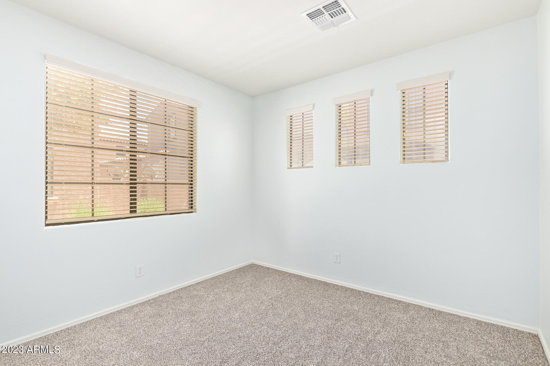 2390 West Sleepy Ranch Road Phoenix, AZ 85085 - Photo 22 of 27 an empty room with a window