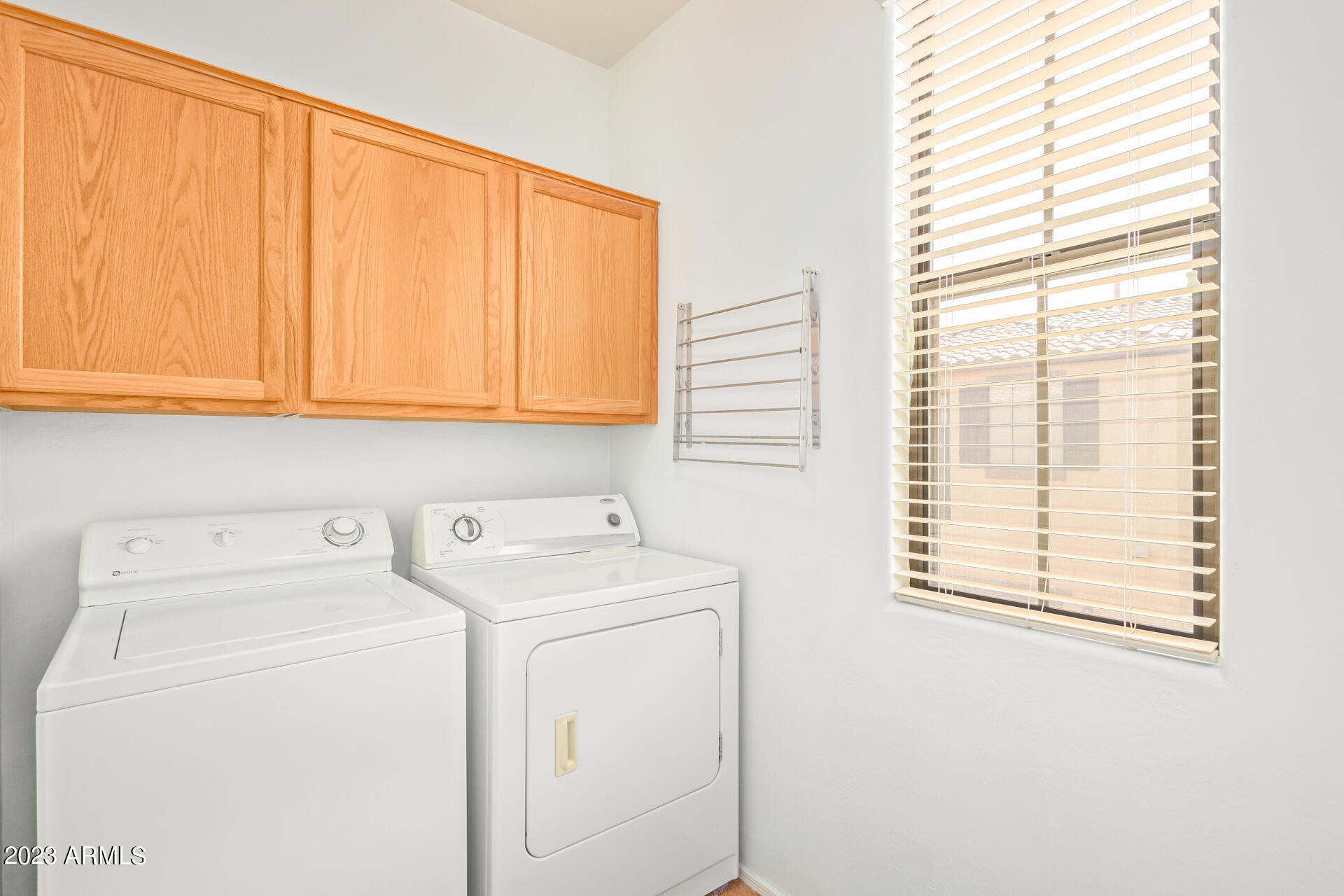 2390 West Sleepy Ranch Road Phoenix, AZ 85085 - Photo 24 of 27 a utility room with dryer and washer