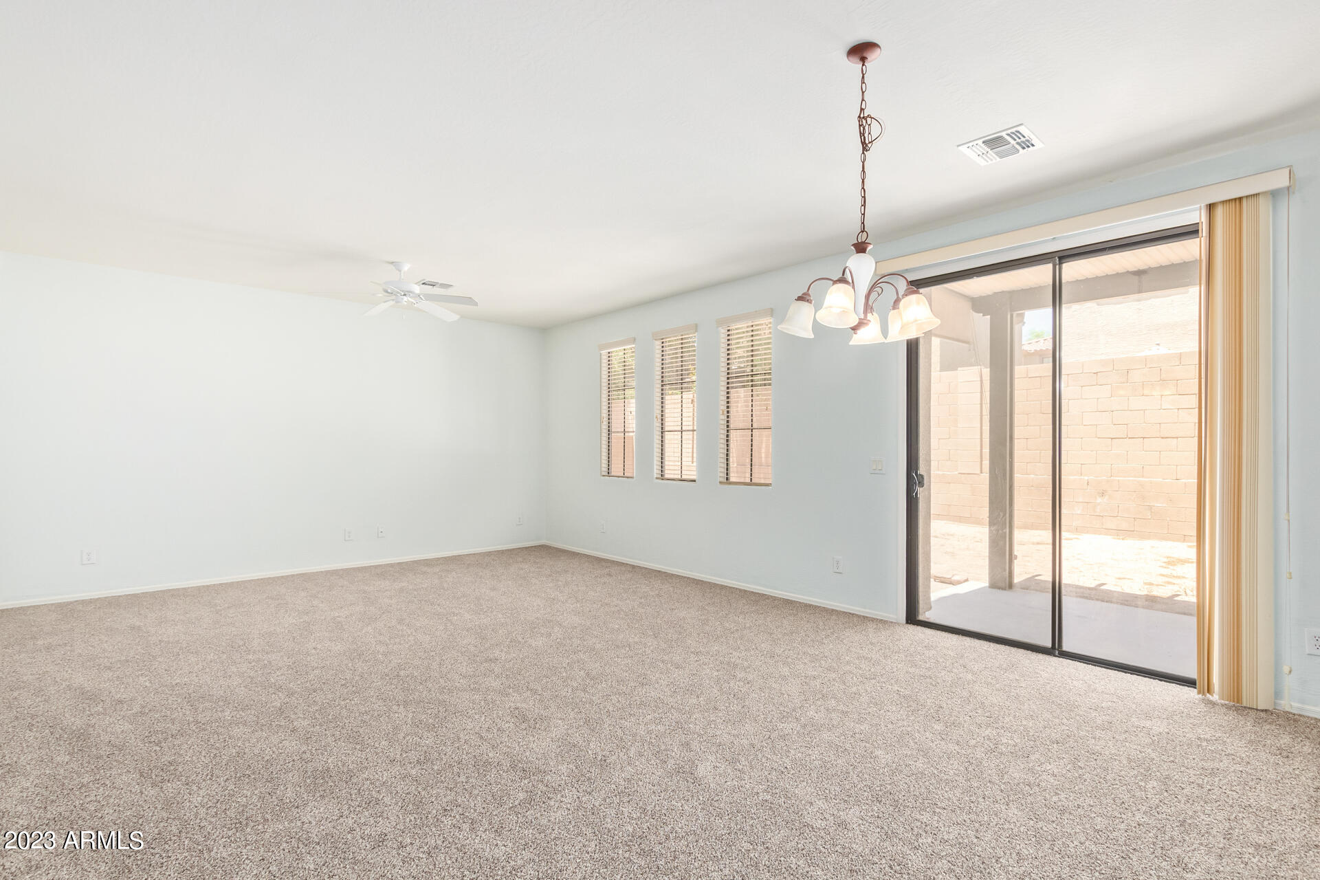 2390 West Sleepy Ranch Road Phoenix, AZ 85085 - Photo 4 of 27 a view of an empty room with a window