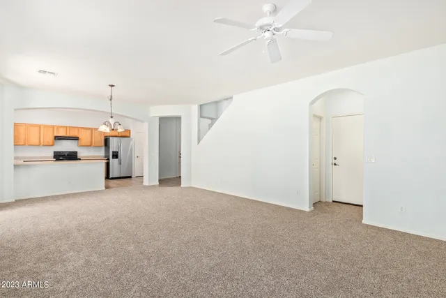 a view of a kitchen with cabinet and a ceiling fan