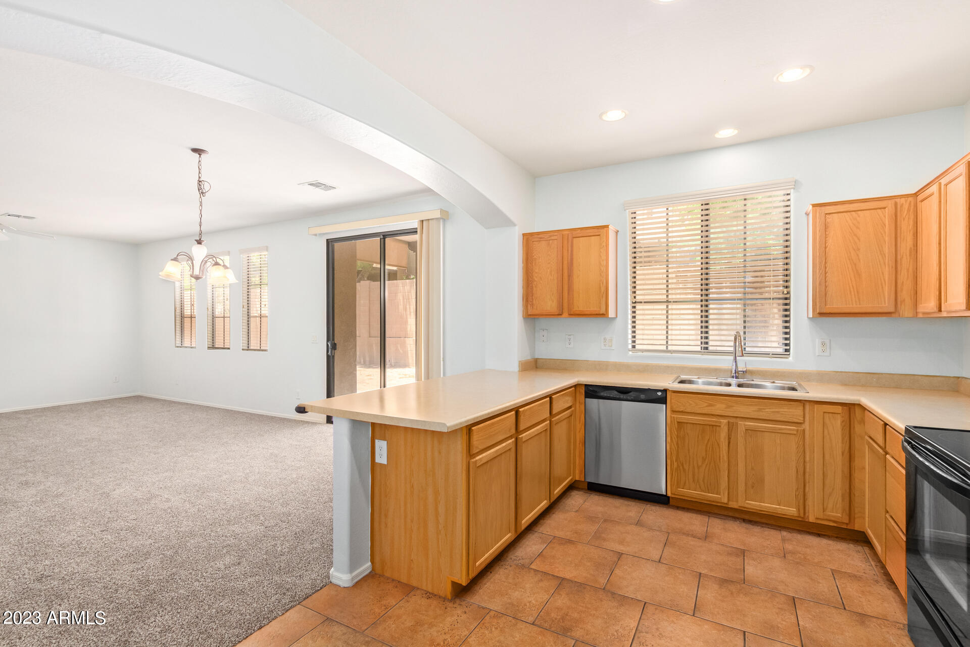 2390 West Sleepy Ranch Road Phoenix, AZ 85085 - Photo 9 of 27 a kitchen with stainless steel appliances granite countertop a sink and a stove